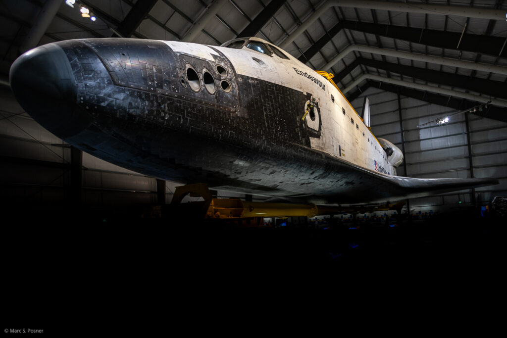 Photograph of space shuttle Endeavour showing the full left side of the orbiter.