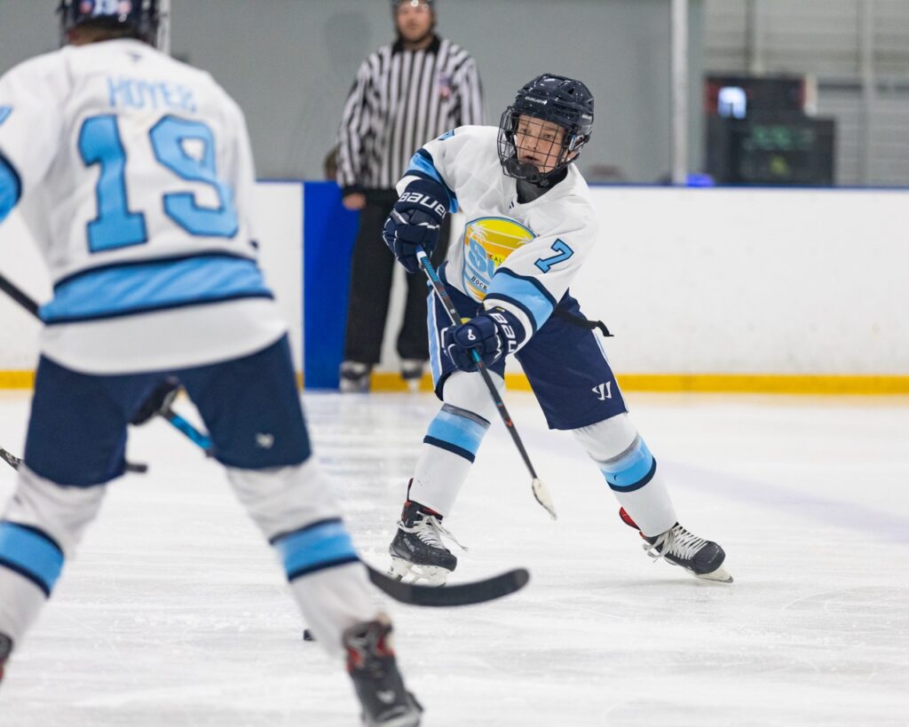 a hockey player makes a pass