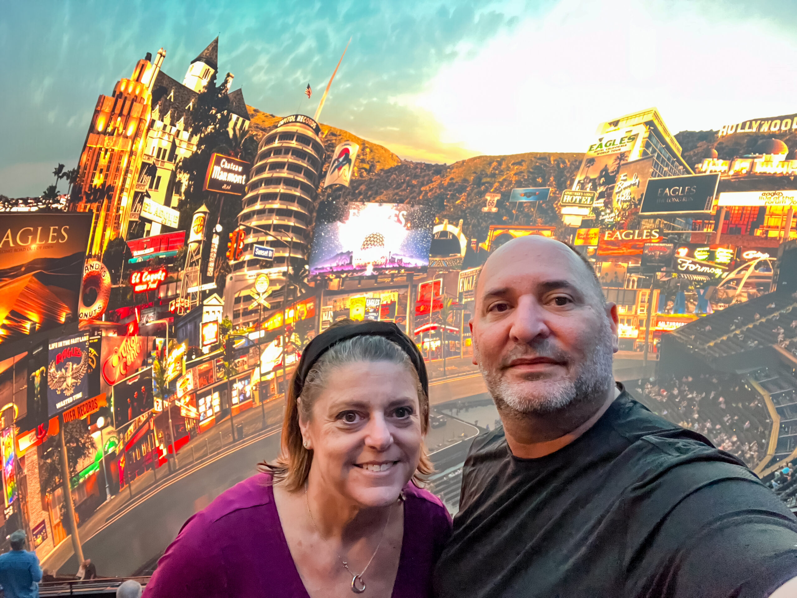 two people standing in the upper deck of the Sphere in Las Vegas
